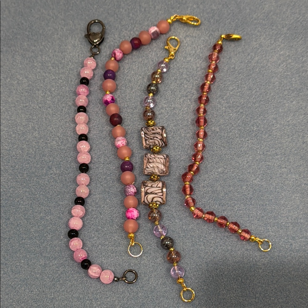 Set of Four Beaded Bracelets in Pink and Purple